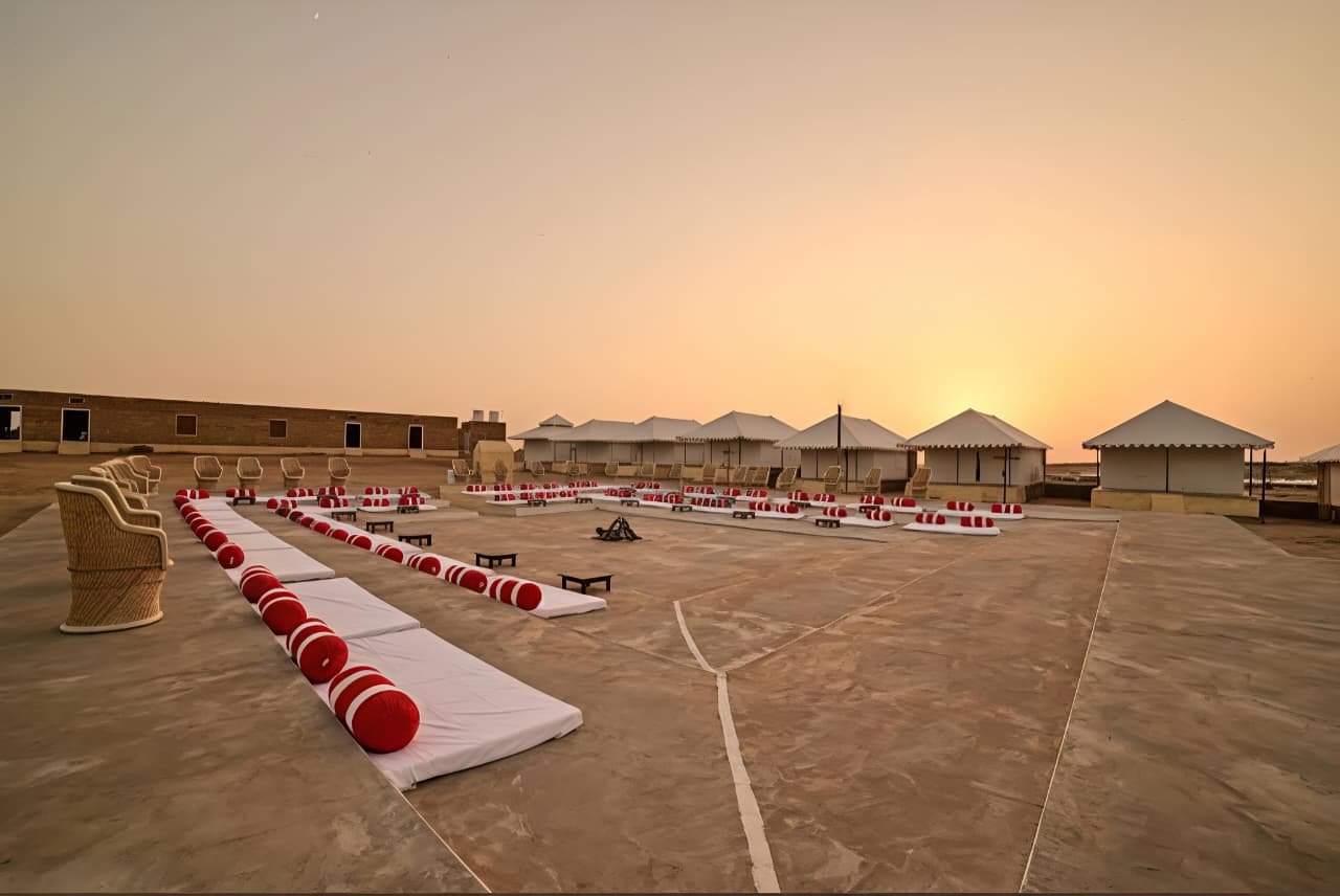 Desert camp at night with lanterns